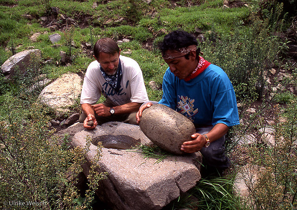 Antropologist Gary Ziegler examining morser stone with native in Vilcabamba region, Peru: PPGInc4_3