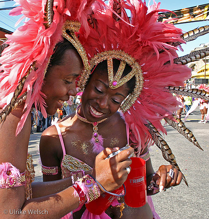 Two young women sharing photos during the morning parade in Trinidad, West Indies: 895_9598